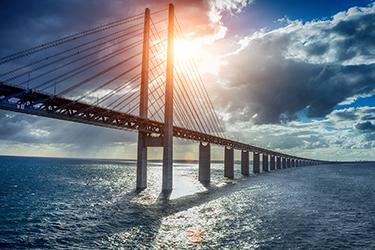 the scenic Öresund Bridge, suspended over the sea.